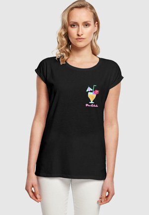 Black short-sleeve T-shirt featuring a colorful Piña Colada graphic with a glass, umbrella, and flower. Soft cotton material, relaxed fit.