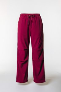 Βαμβακερό παντελόνι μπορντό, κατασκευασμένο από ελαφρύ ύφασμα, με ελαστική μέση και πλαϊνές λεπτομέρειες από αντίθετο υλικό με διακοσμητική επένδυση.