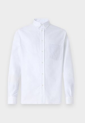 Hvit langermet skjorte med knapper laget av bomull, med en brystlomme med tonalt broderi, krage og knappeender.
