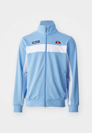 Light blue track jacket with white horizontal stripes, zip front, high collar, side pockets, and embroidered logo on chest. Smooth fabric texture.