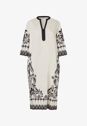 Robe crème longueur genou avec imprimés bordures floraux et géométriques noirs, manches trois-quarts, et col en V bordé de noir avec détails de boutons.