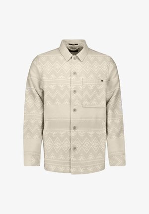 Lichtbeige jas met knopen, voorzien van geometrische zigzag- en diamantpatronen, een borstzak en een kraag.