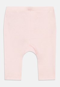 Leggings cor-de-rosa claro em algodão, com cintura elástica, comprimento até ao joelho e textura suave, sem padrões ou adornos.