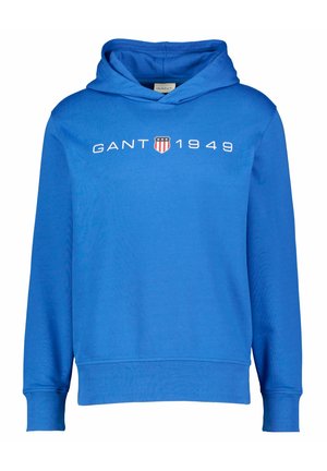 Hanorac albastru dintr-un amestec de bumbac, cu un logo "GANT 1949" pe partea din față, având un buzunar tip cangur și manșete și tiv din tricot.