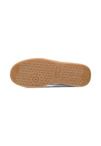 Sola della scarpa con texture a nido d'ape, materiale in gomma, colore marrone chiaro e dettagli decorativi per una presa ottimale.
