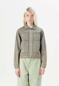 Denim jacket in faded gray with a zip front, collared neck, and two large front pockets. Features a cropped design and long sleeves.