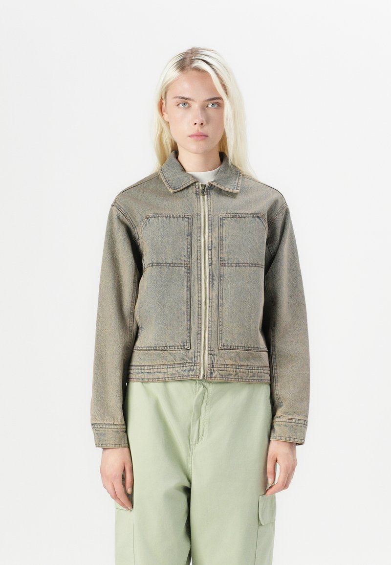 Denim jacket in faded gray with a zip front, collared neck, and two large front pockets. Features a cropped design and long sleeves.