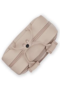 Beige bag with a smooth surface, rounded edges, and mesh accents. Features a central button closure and decorative straps.