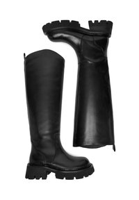 Mustad säärejooned saapad, mis on valmistatud siledast nahast, paksu ja soonilise tallaga ning voolujoonelise disainiga. Küljel on tõmblukk, mis teeb jalga panemise lihtsaks.