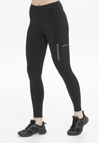 Zwarte actieve leggings met een hoge tailleband, voorzien van een zijzak en witte tekst "ENDURANCE". Glad ontwerp en aansluitende pasvorm.