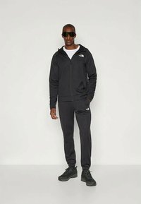 The North Face REAXION JOGGER - Treningo apatinė dalis - black heather