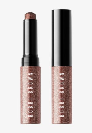 Crayon fard à paupières en crème scintillante rose doré Bobbi Brown, présenté avec son capuchon sur et hors fond blanc.