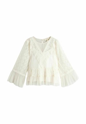 Weißes Spitzentop mit ausgestellten langen Ärmeln, geschichtetem Tüll-Peplum, V-Ausschnitt und floralen Mustern sowie einer feinen Textur.