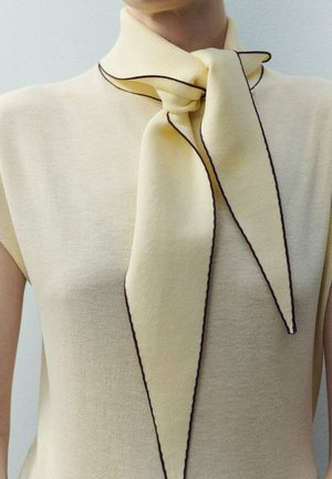 Yellow knit top featuring a large, bow-like scarf detail with contrasting dark trim, smooth texture, and short sleeves.