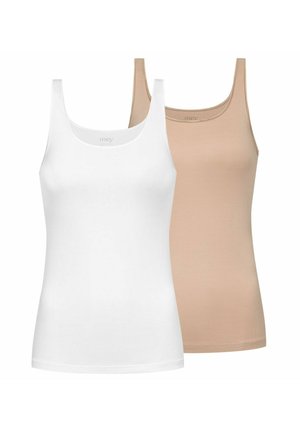 Woman with braided hair wearing a beige tank top and matching underwear standing against a plain light background.