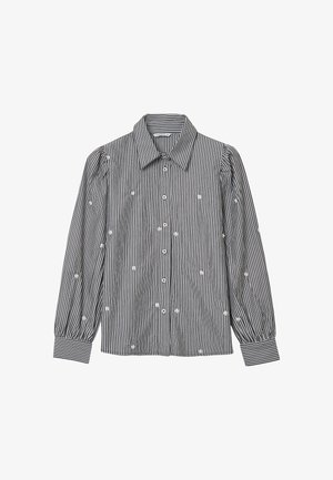 Schwarz-weiß gestreifte, langärmlige Bluse mit Puffärmeln und kleiner weißer Blumenstickerei, die über den Stoff verteilt ist.