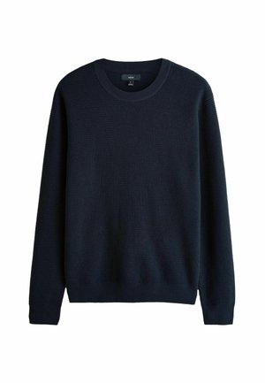 Tumši zils adīts džemperis ar tekstūru, apaļu kakla izgriezumu un ribota piedurkņu un apakšmalas apdari. Izgatavots no mīksta materiāla, lai nodrošinātu komfortu.