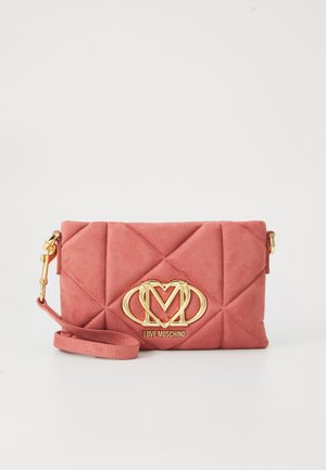 Pink suede clutch bag with diamond quilted pattern, gold-tone hardware, and logo detail. Includes a detachable strap for versatility.