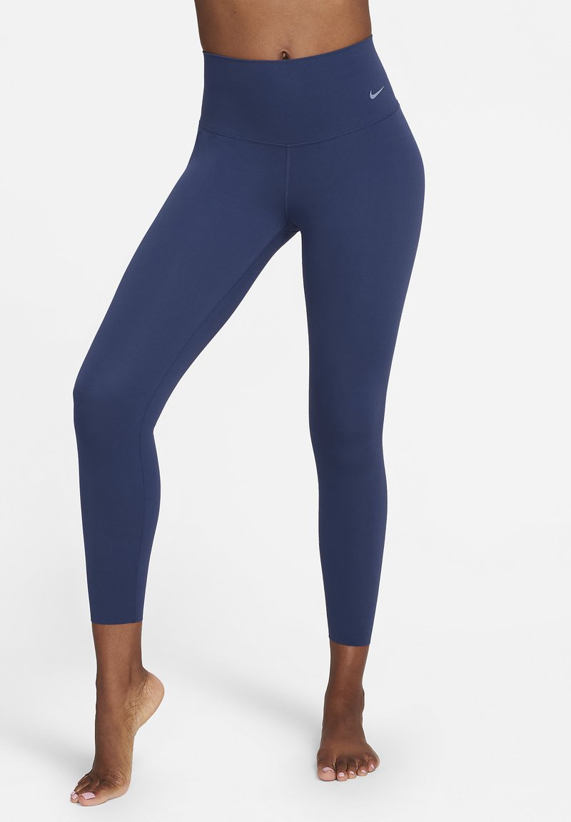 Navyfarbene Sportleggings aus dehnbarem Stoff, mit hohem Bund, nahtlosem Design und figurbetonter Passform, geeignet für Activewear.