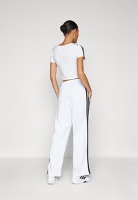 adidas Sportswear Treniņtērpa apakšdaļas - white/black