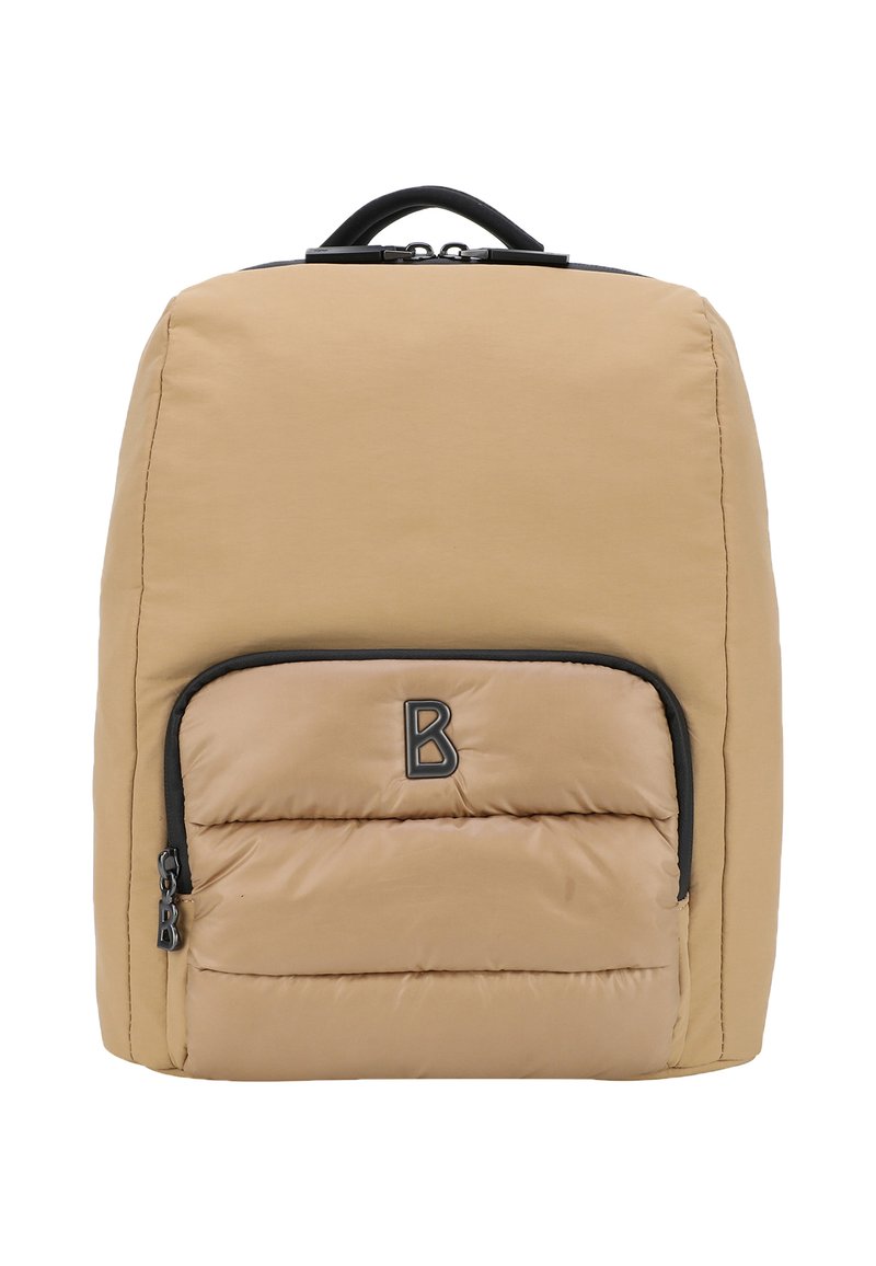 Zaino imbottito color tan con forma arrotondata, dettagli in zip nera e una tasca frontale prominente. Presenta una maniglia superiore per il trasporto.
