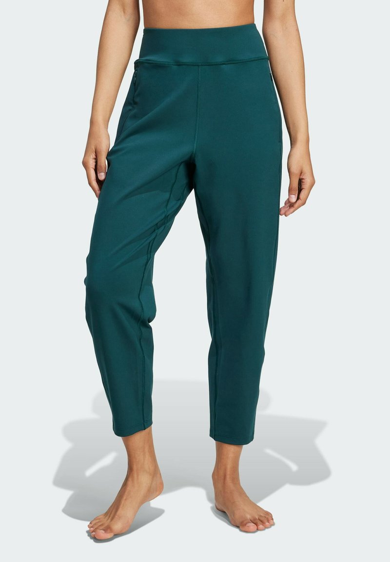 Türkisfarbene, tapered Hosen mit hohem Bund und Seitentaschen, aus einem glatten, elastischen Stoff. Knöchellang mit einem eleganten Design.