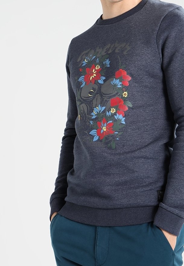 Felpa blu navy con stampa floreale in rosso, blu e giallo, dotata di scollatura rotonda e polsini e orlo a coste.