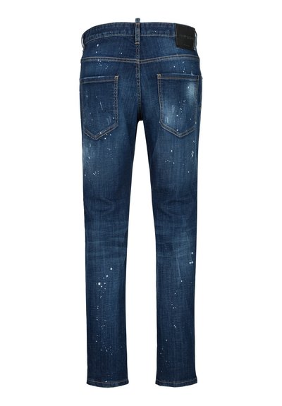 Jean en denim bleu foncé avec deux poches arrière et des éclaboussures de peinture blanche sur tout le tissu.