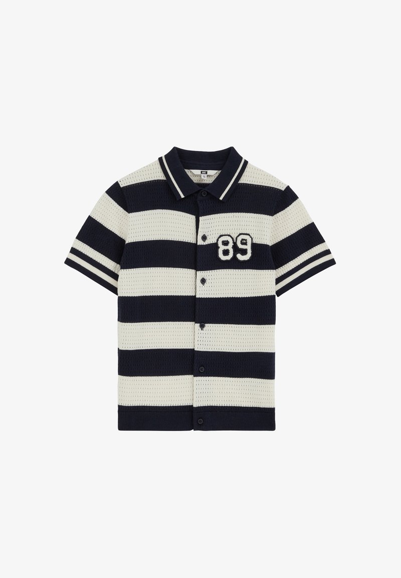 Polo manches courtes avec boutons, rayures horizontales noires et blanches et numéro 89 brodé sur le côté gauche de la poitrine.