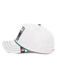White baseball cap with green accents, curved brim, embroidered patch design, zigzag stitching, and a contrasting logo tag on the side.