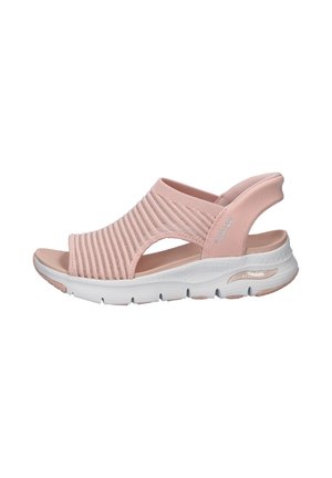 Light pink Skechers open-toe sandal with ribbed fabric upper, back strap, and white cushioned arch support sole.