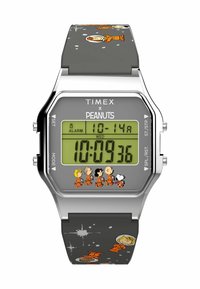 Orologio digitale con cassa argentata e cinturino in silicone grigio, che presenta Snoopy e i personaggi dei Peanuts in tute spaziali arancioni su uno sfondo stellato.
