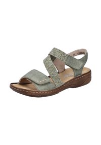 Sandale en daim vert avec des lanières en tissu texturé, design à bout ouvert et semelle rembourrée marron. Présente un détail cousu et une lanière réglable.