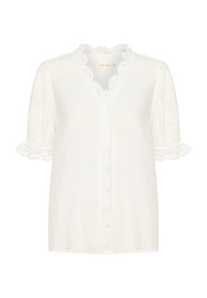 Fehér blúz rövid puffos ujjakkal, csipkeszegéllyel a gallér és az ujjak mentén, valamint gombos elejével. Könnyű anyagból készült.