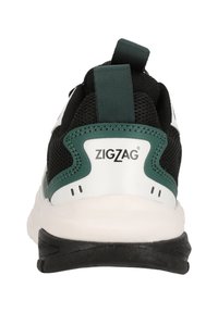 Schwarzer Sportschuh mit weißen und grünen Akzenten, ausgestattet mit einem strukturierten Mesh-Obermaterial, einem Zugband und einer schwarzen Gummisohle. Markenlogo sichtbar.