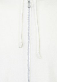 Felpa con zip bianca realizzata in tessuto a maglia testurizzata, con zip argentata e lacci regolabili sul cappuccio.