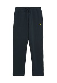 Marina sweatpants gjorda av mjukt tyg, med ett elastiskt midjeband med snörning och en liten gul logotyp på vänstra låret.