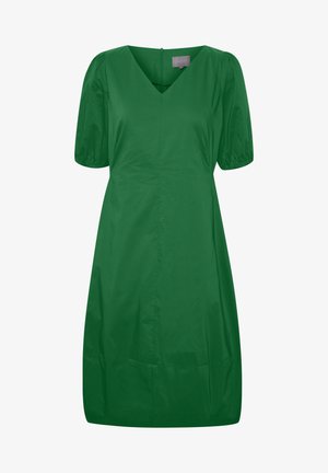 Robe verte, longueur genou, avec un décolleté en V, des manches courtes bouffantes et une texture lisse. Dispose d'une fermeture éclair au dos et de coutures minimales.