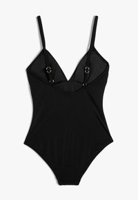 Maillot de bain une pièce noir avec bretelles spaghetti réglables, décolleté en V profond et accents métalliques. Tissu doux avec un stretch minimal.