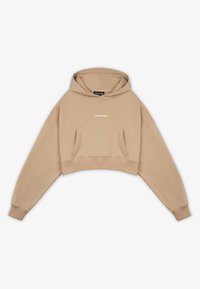 Sudadera corta color beige hecha de tela suave. Presenta un bolsillo frontal y el logo blanco "PEGADOR" encima del bolsillo. Corte holgado y mangas amplias.