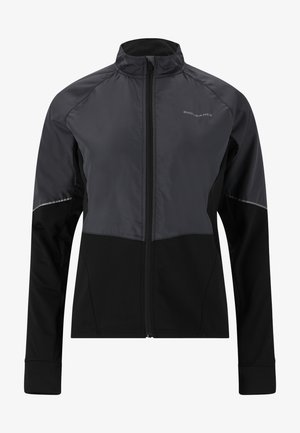Svart och grå atletisk jacka med hög krage, blixtlåsstängning och reflexdetaljer. Har en kombination av släta och texturerade tyger.