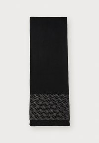 Sort håndklæde med tekstureret overflade, der har et dekorativt hvidt geometrisk mønster i den nederste kant. Rektangulær form, blødt stof.