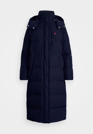 Navy puffer coat with a high collar, front zipper and snap closures, two side pockets, and a small logo accent on the chest.