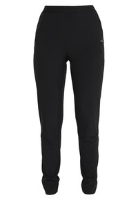 Černé sportovní kalhoty vyrobené z elastického materiálu, s přiléhavým střihem, zúženými nohavicemi a malým logem na horní straně.