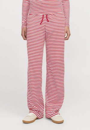 Pantalons de lounge à rayures rouges et blanches en tissu doux, avec une coupe décontractée, une taille élastique et un cordon de serrage.