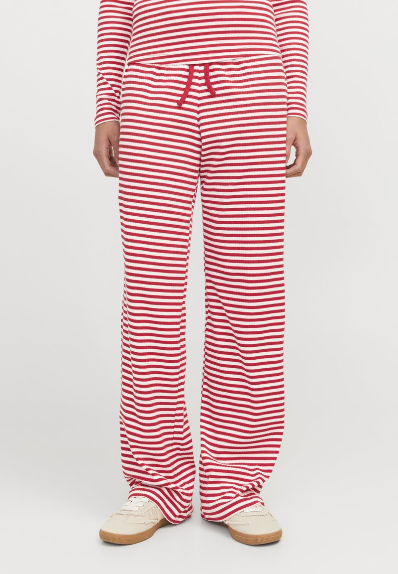 Rote und weiße gestreifte Lounge-Hosen aus weichem Material, mit lässigem Schnitt, elastischem Bund und Kordelzug-Detail.