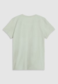 T-shirt en coton vert clair avec des manches courtes, un col rond et une texture lisse. L'arrière est plain et sans ornement.