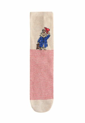 Beige Sock mit roten und weißen Streifen, auf dem ein gesticktes Figurenmotiv in einem blauen Mantel, mit einem roten Hut und einem Koffer in der Hand zu sehen ist.