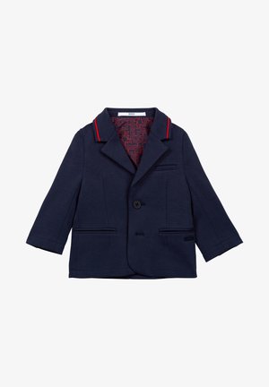 Blazer pour tout-petit bleu marine avec bordure rouge sur le col, deux poches avant, fermeture à un bouton, et doublure intérieure rouge à motifs.