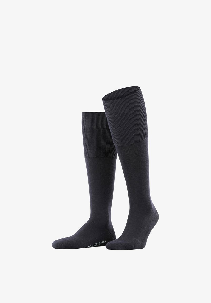 Chaussettes montantes gris foncé avec une texture côtelée en haut et un matériel lisse en dessous. Présentent un logo à la cheville.